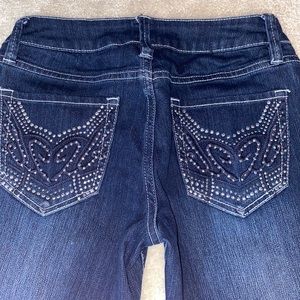 2b Bebe skinny jeans with bedazzled back pockets.